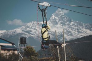 zipline rider descending from Sarangkot to Hemja Pokhara