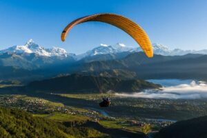 paragliding in Pokhara over Phewa Lake with Annapurna mountains